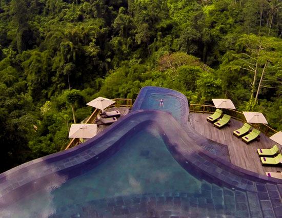 10 enticing pools that you wanna jump into,hanging gardens ubud hotel,neptune pool at the hearst castle in san simeon,california,the library pool in koh samui,thailand,cambrian pool,switzerland,bali,bali,infinity pool,singapore,st. regis in lhasa,tibet,chongwe river house pool,africa,belmond jimbaran puri resort,the san alfonso del mar seawater pool,chile,golden nugget pool in las vegas,nevada