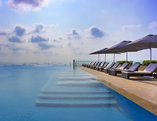 10 enticing pools that you wanna jump into,hanging gardens ubud hotel,neptune pool at the hearst castle in san simeon,california,the library pool in koh samui,thailand,cambrian pool,switzerland,bali,bali,infinity pool,singapore,st. regis in lhasa,tibet,chongwe river house pool,africa,belmond jimbaran puri resort,the san alfonso del mar seawater pool,chile,golden nugget pool in las vegas,nevada