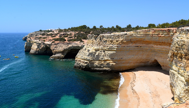 portugal,visit portugal,must-visit places,portuguese culture,portuguese cuisine,lisbon,porto,sintra,algarve,douro valley,Évora,coimbra,azores,tourism in portugal,european travel,cultural heritage,historical landmarks,coastal beauty,natural landscapes,unesco world heritage sites,european destinations,travel experiences,exploration,adventure,sightseeing,landmarks,vacation spots,coastal attractions,scenic beauty,cultural diversity,architecture,local traditions,gastronomy,wine tourism,vineyards,outdoor activities,nature walks,hiking trails,island hopping,sustainable tourism