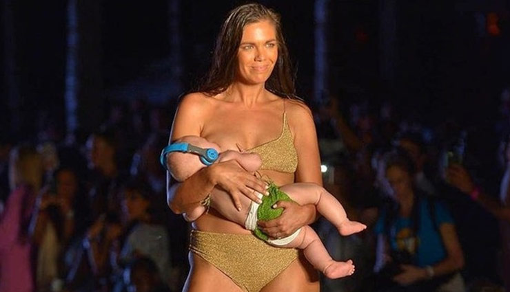 American model breastfeeds baby on catwalk