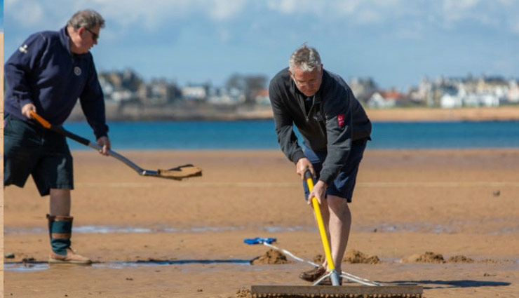 beach cricket,pitch blows,makes together,hit ball in water,near tourist,out,gali cricket,rules,8 players,white kit,weird story