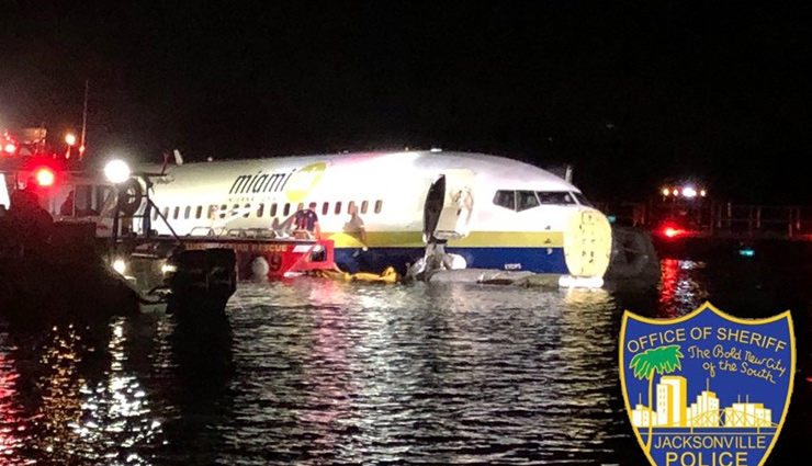 Boeing 737 with 136 on board skids off runway, falls into Florida river; no casualties reported