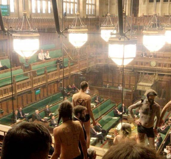 british mps,house of commons britain,protesters stripped,british parliament,stripped protest