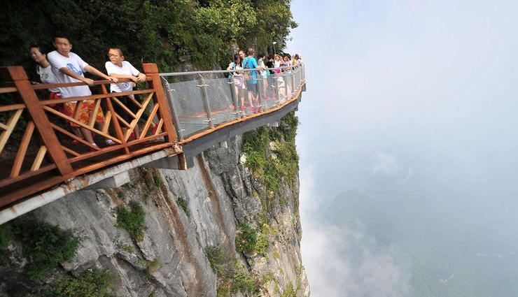 cliff paths to explore around the world,amazing cliff paths,huangshan paths,china,capri island path,italy,walkways of the tianmen mountain,china,path to gaztelugatxe,spain,skellig michael path,ireland,donkey path in santorini,greece