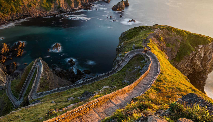 cliff paths to explore around the world,amazing cliff paths,huangshan paths,china,capri island path,italy,walkways of the tianmen mountain,china,path to gaztelugatxe,spain,skellig michael path,ireland,donkey path in santorini,greece