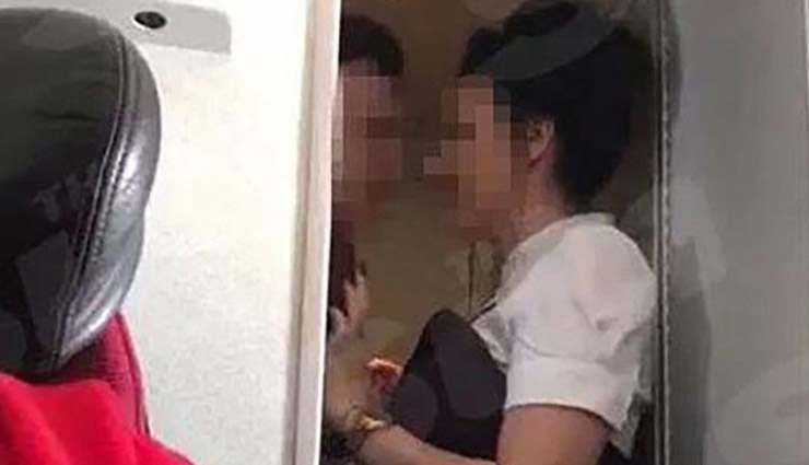 VIDEO- Couple Caught Getting Intimate in Plane Washroom, Caught By Airhostess
