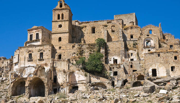 ghost places around the world,abandoned places tourism,kolmanskop namibia ghost town,craco italy abandoned town,hashima island gunkanjima japan,beelitz sanatorium germany abandoned,maunsell forts england history,deserted places attractions,urban exploration destinations,forgotten landmarks tourism