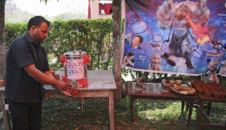 all india hindu mahasabha,drinking,cow,urine,gaumutra,coronavirus,gomutra party,weird news