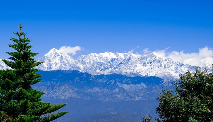 must visit places in uttarakhand,uttarakhand tourism,best places to visit in uttarakhand,auli skiing,chopta valley trekking,binsar wildlife,ranikhet winter getaway,munsiyari adventure,chamba scenic views,khirsu hiking,chaukori tea plantations,almora cultural significance,dhanaulti snowfall,nainital winter destination,rishikesh spiritual retreat,haridwar pilgrimage,jim corbett safari,kausani himalayan views