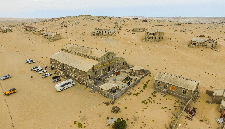 ghost places around the world,abandoned places tourism,kolmanskop namibia ghost town,craco italy abandoned town,hashima island gunkanjima japan,beelitz sanatorium germany abandoned,maunsell forts england history,deserted places attractions,urban exploration destinations,forgotten landmarks tourism