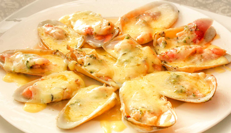 chile,famous food for chile,chile food,curanto,chorillana,sopaipillas,empanada de pino,milcao,pastel de jaiba,machas a la parmesana,choriqueso,chancho en piedra,chumbeque,travel,holidays,travel guide