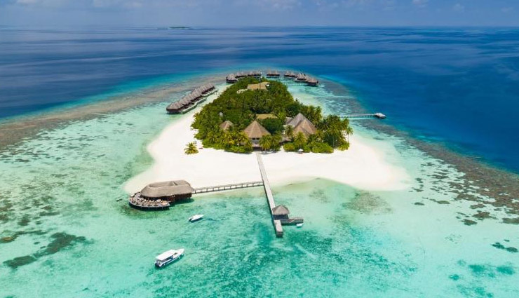 10 tourist attractions in maldives,must-visit places in maldives,top maldives tourist spots,popular islands in maldives,best beaches maldives,maldives honeymoon destinations,male atoll maldives,maldives snorkeling spots,vaadhoo island bioluminescence,rangali island luxury resorts,hanifaru bay marine life.