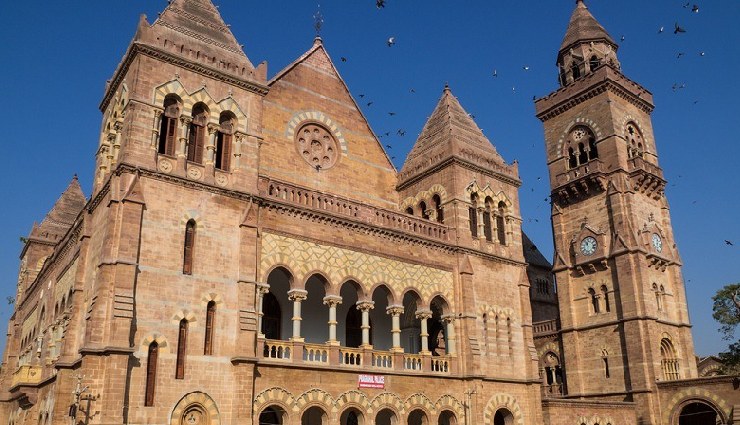 historical places in gujarat,must-visit places in gujarat,dwarkadhish temple,laxmi vilas palace,modhera sun temple,rani ki vav,dholavira heritage site,prag mahal bhuj,aina mahal bhuj,sabarmati ashram,champaner-pavagadh archaeological park,kirti temple porbandar