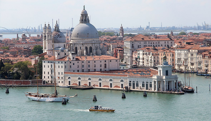 wonder buildings built on water,burj al arab,our lady of the rocks,veluwemeer aqueduct,venetian islands,punta della dogana,jal mahal,pampus,peberholm,deeg water palace,kansai airport,ile aux cygnes,travel,travel tips,holidays,travel guide