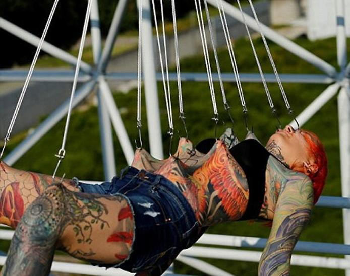 extreme body piercing,shocking photos,weird story,weird news hindi,omg story hindi