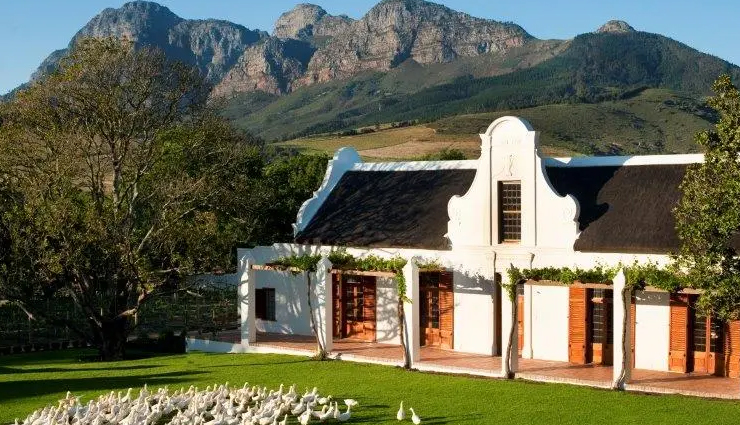 south africa,historical places in south africa,places to visit in south africa,table mountain,robben island,muizenbergs beach huts,cape dutch homesteads of the winelands,southernmost tip of africa,hole in the wall