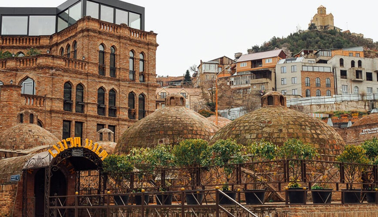 holy trinity cathedral,ride a cable car to narikala fortress,walk over the bridge of peace,bathhouses of abanotubani,shop at the intriguing dry bridge bazaar,have fun in mtatsminda park,rezo gabriadze marionette theater,tbilisi botanical garden,georgian national museum,lake lisi,tbilisi,places to visit in tbilisi,things to do in tbilisi