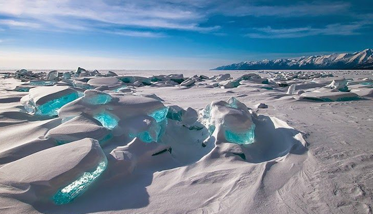 pamukkale in turkey,fly geyser in nevada,emerald of ice on lake baikal in russia,zhangye danxia landform in gansu china,grand prismatic spring in us,red beach in panjin in china,unique places in the world