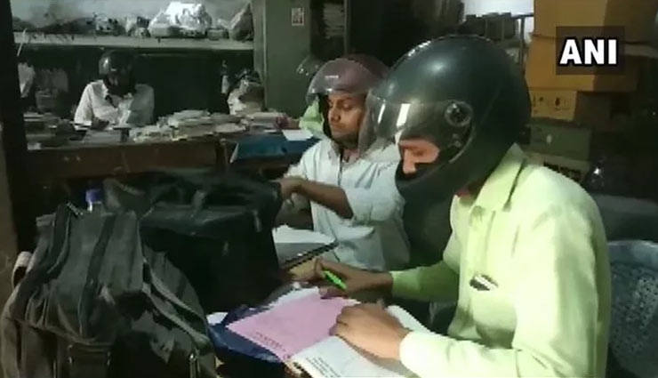 UP govt employees wear helmets while work in building with holes in roof