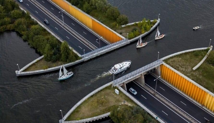 wonder buildings built on water,burj al arab,our lady of the rocks,veluwemeer aqueduct,venetian islands,punta della dogana,jal mahal,pampus,peberholm,deeg water palace,kansai airport,ile aux cygnes,travel,travel tips,holidays,travel guide