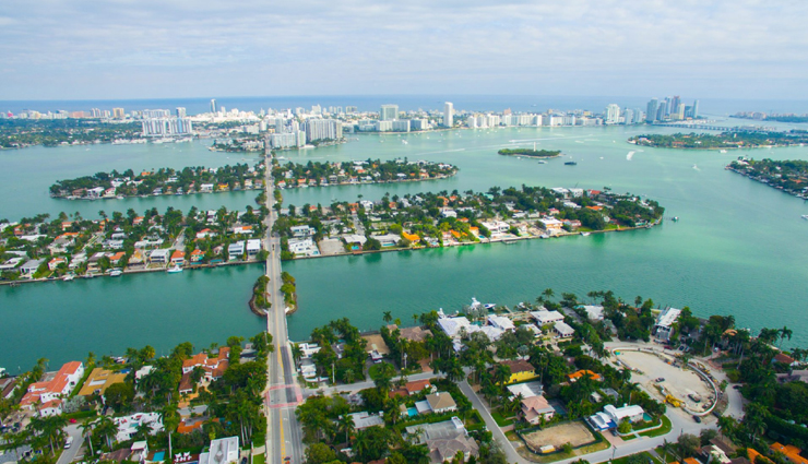 wonder buildings built on water,burj al arab,our lady of the rocks,veluwemeer aqueduct,venetian islands,punta della dogana,jal mahal,pampus,peberholm,deeg water palace,kansai airport,ile aux cygnes,travel,travel tips,holidays,travel guide