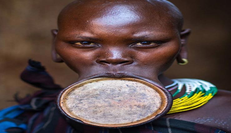 weird news,weird information,ethiopian suri tribe,stretch lip plates girls beauty