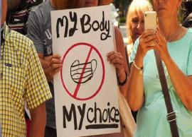 முகக்கவசம் கட்டாயமாக்கப்படுவதை எதிர்த்து பேரணி