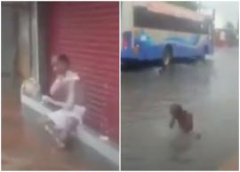 சாலையில் தேங்கியிருந்த மழைநீரில் ஆனந்த குளியல் போடும் முதியவர்