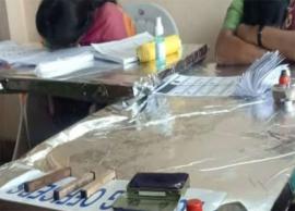 ఓటర్లు లేక పోలింగ్ కేంద్రంలో నిద్రపోతున్న సిబ్బంది.. ఫొటో వైరల్...